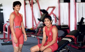 Mahavir Singh’s niece Vinesh Phogat (left) and daughter Babita Phogat won golds at the 2014 Commonwealth Games in Glasgow